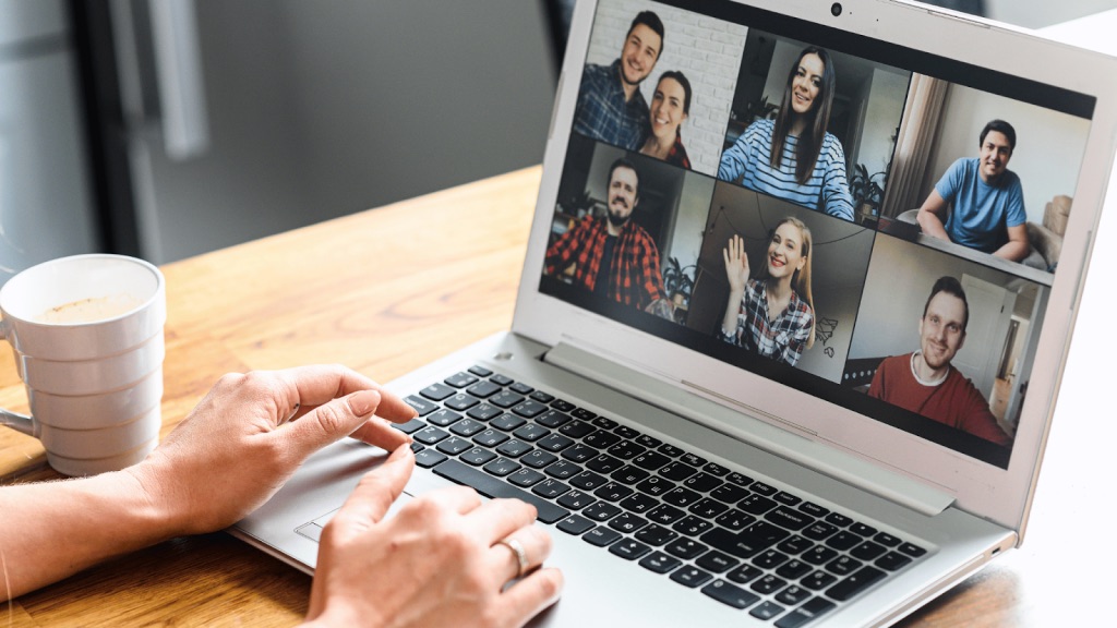 a woman talking to seven of her friends in a Zoom meeting